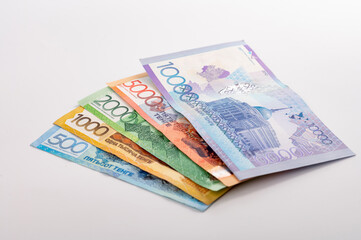 Kazakhstan money - tenge. 500, 1000, 2000, 5000, 10000 banknotes. Close up of tenge on white background.