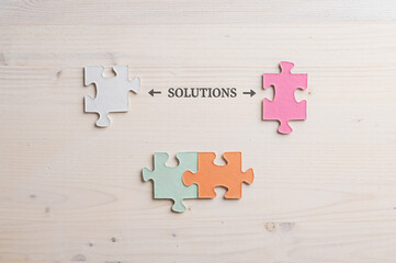 Conceptual image of problem solving with word Solution spelled over wooden background