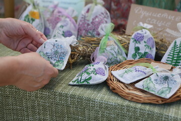 Woman chooses a sachet with lavender