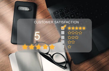 Top desk as background with VR screen for rating a service. Customer review satisfaction feedback concept. User give five stars to service experience on online application. Business reputation.