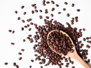 Coffee Beans on Wooden Spoon with White Background,Organic Brown Coffee,Flat lay and Free space for Presentation,Drink have Caffeine concept.
