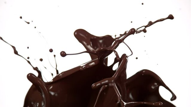 Super Slow Motion Shot of Splashing Melted Chocolate Isolated on White Background at 1000 fps.