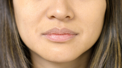 Portrait of facial features of a young woman with a neutral expression 