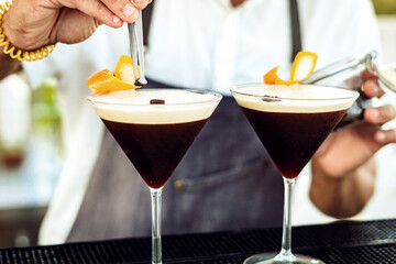 two dark drinks in a glass
