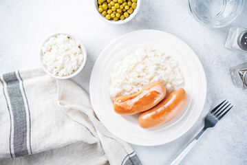 Fried sausages with rice in a plate