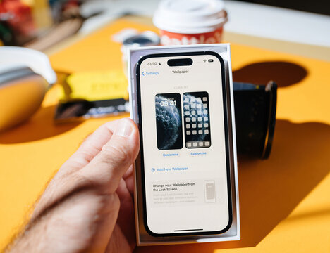 Paris, France - Sep 17, 2022: Setting Up New Smartphone - Add New Wallpaper In The IOS 16 Os On The New IPhone 14 Pro Max Smartphone By Apple Computers