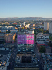 Aerial view of People Make Glasgow sign on tall tower building in city centre
