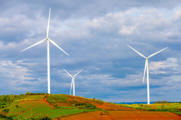 Fototapeta premium Wind farms for generating electricity, a clean alternative energy that does not cause pollution and negatively affect the global climate change.