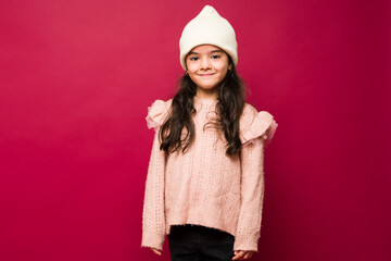 Cute little girl smiling wearing winter clothes
