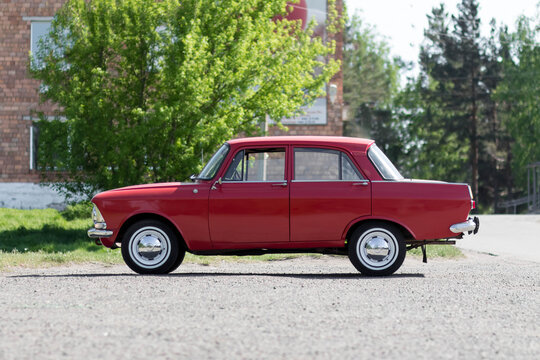 KRASNOYARSK, RUSSIA - May 19, 2020: Red retro car Moskvich 412. Whitewalls. Car of the year 1982