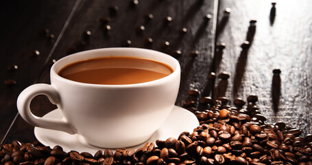 Composition with cup of coffee and beans