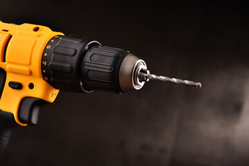 Cordless drill with drill bit working also as screw gun