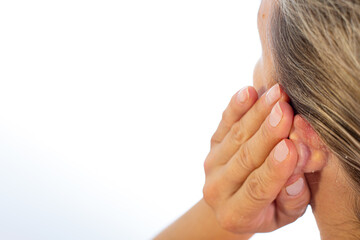 Psoriasis behind the ear. Psoriatic redness, peeling and crusting behind the ear of an...