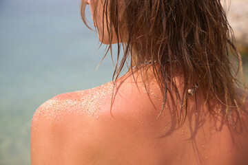 Woman's hair on the beach. Wet hair close up image. Hair damage due to salty ocean water and sun,...
