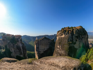Scenic view of Holy Monastery of Varlaam seen from Holy Monastery of Great Meteoron, Kalambaka, Meteora, Thessaly, Greece, Europe. Dramatic landscape. Orthodox landmark build on rock formations