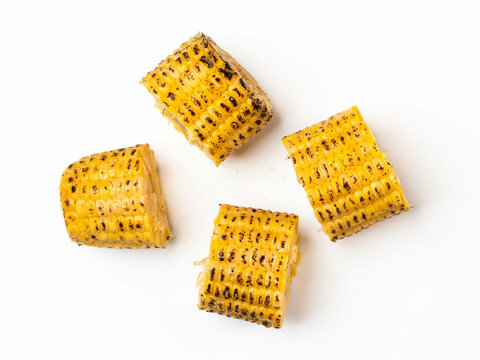 Grilled Corn On The Cob Pieces On White Background. Top View.