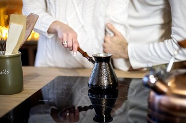 happy married couple making coffee in the morning