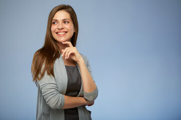 Thinking smiling business woman touching her face, looking left side. isolated portrait.