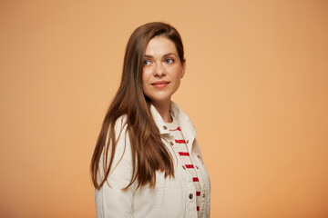 Confident smiling woman in white jacket looking away. isoalted portrait on yellow background.