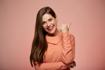 Smiling woman in casual hoody showing thumb up. Isolated female portrait.
