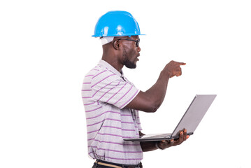 young man engineer holding laptop and pointing finger at whiteboard.