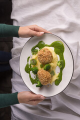 panko breaded meat with potatoes on a light fabric background