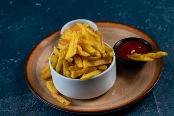 Crispy French Fries or potato chips with mayo dip and tomato sauce served in a plate side view view