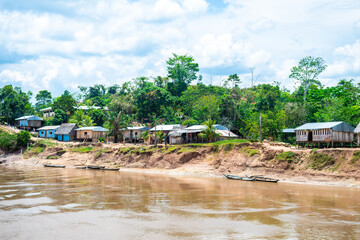 shanty village at peruvian amazon riverbank