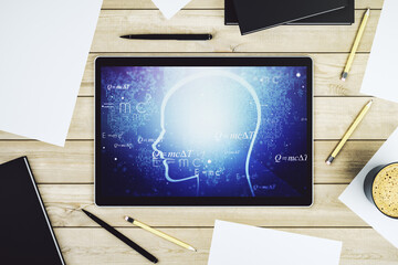 Creative artificial Intelligence concept with human head hologram on modern digital tablet screen. Top view. 3D Rendering