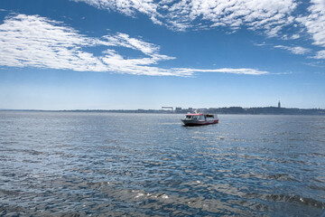 Tour boat sailing on the sea in Lisbon