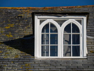 Old fashioned dormer windows, England, UK. In shape of letter 'm'.