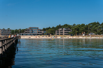 Fototapeta na wymiar Sweden, Ahus – August 4, 2022: Crowded beach on a hot sunny summer day. Beautiful Black Sea.