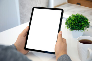 male hands holding computer tablet with isolated screen in office