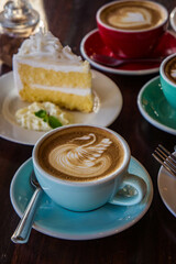 coffee time in the wood table cafe , drink coffee and tasty cake