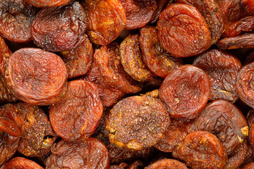 Naturally dried apricotes, background, texture. Uzbek food. Selective focus. High quality photo