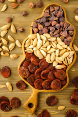 Tasty fresh almond nuts, naturally dried apricotes, naturally dried figs, background, texture. Uzbek food. Selective focus. High quality photo