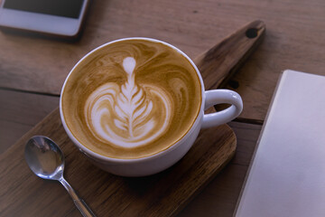coffee latte art on wood table , coffee for idea