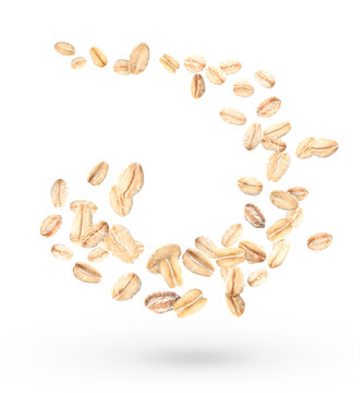 Flying raw oatmeal on white background
