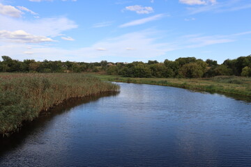 flat river flowing into the distance