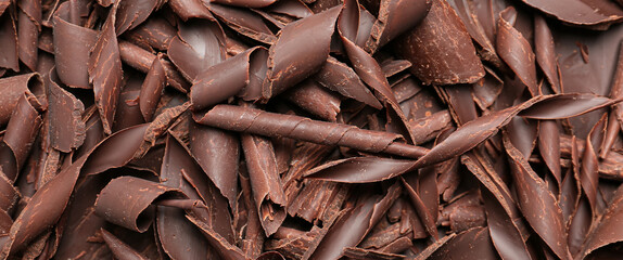 Heap of chocolate curls as background
