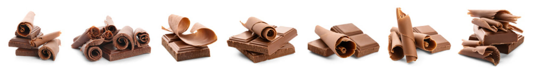 Set of sweet chocolate curls and pieces on white background