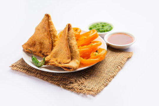 Veg Samosa with Jalebi, snack combination also called imarti and Sambusa, samusa