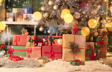 Many gifts under Christmas tree in room