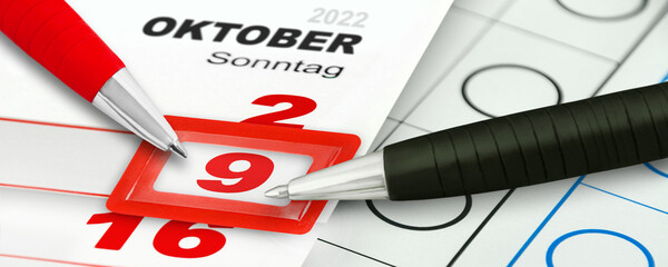 Deutscher Kalender 9. Oktober 2022  Landtagswahl in Niedersachsen und Kugelschreiber mit Stimmzettel