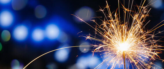 Beautiful Christmas sparkler at night, closeup