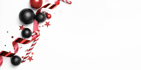 Beautiful Christmas composition with balls and candy cane on white background with space for text