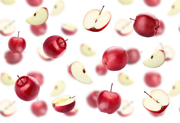 Many flying red apples isolated on white