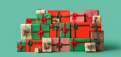 Different Christmas presents on green background