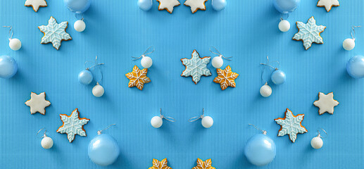 Beautiful Christmas balls and cookies on blue background