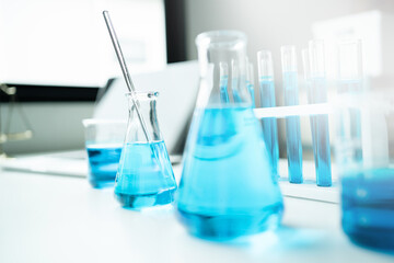 Breakers and glassware in chemistry labs scientific concept analysis biological medicine research and development Close-up of modern laboratory reagent tubes. Chemistry and medical science research.